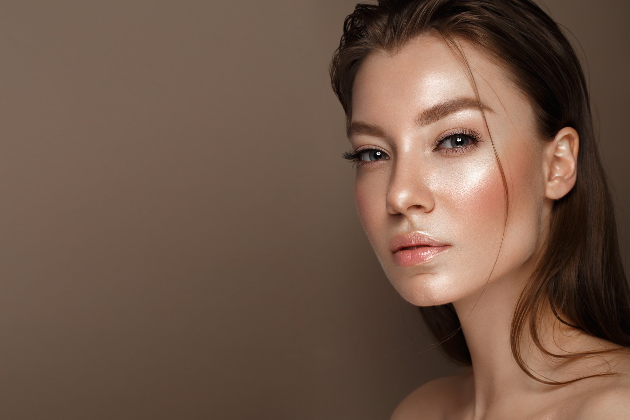 Beautiful young girl with natural nude make-up. Beauty face.